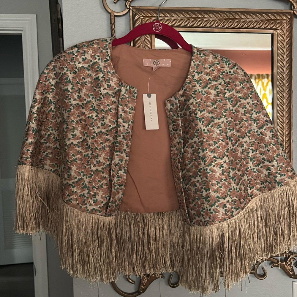 NWT Anthropologie Traffic People Metallic Fringe Cape. One size. Pink Floral